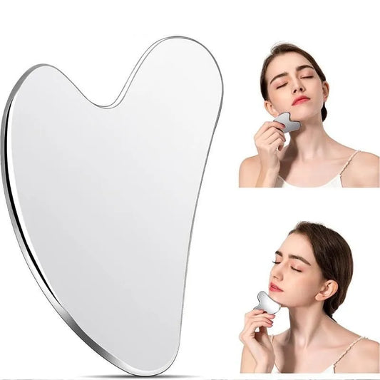 Woman using a heart-shaped gua sha and skincare tool on a white background