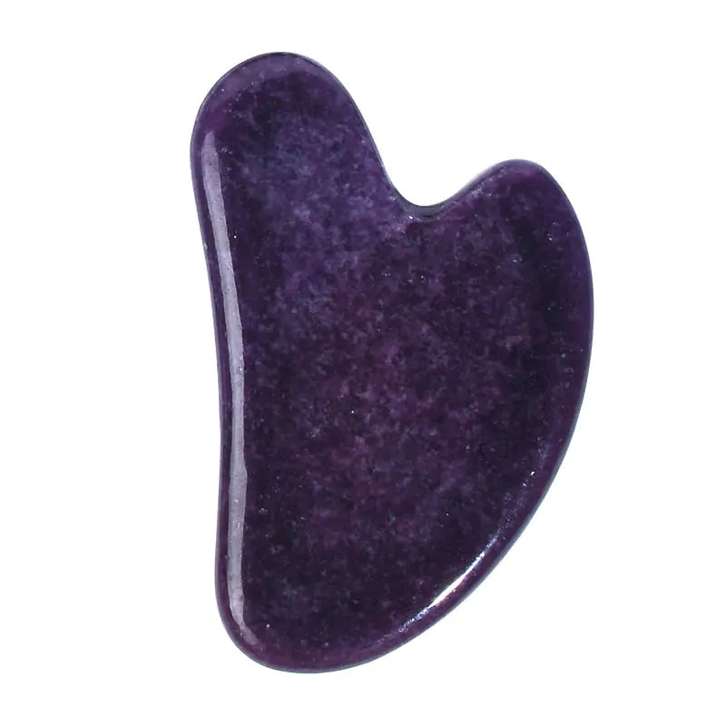 Purple stone tool with a U-shaped design on a white background