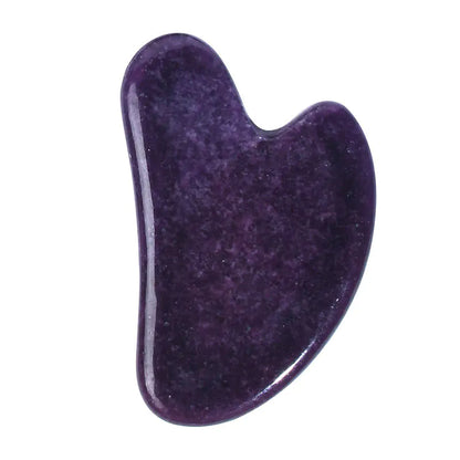 Purple stone tool with a U-shaped design on a white background