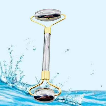 Gold facial roller with water splash background