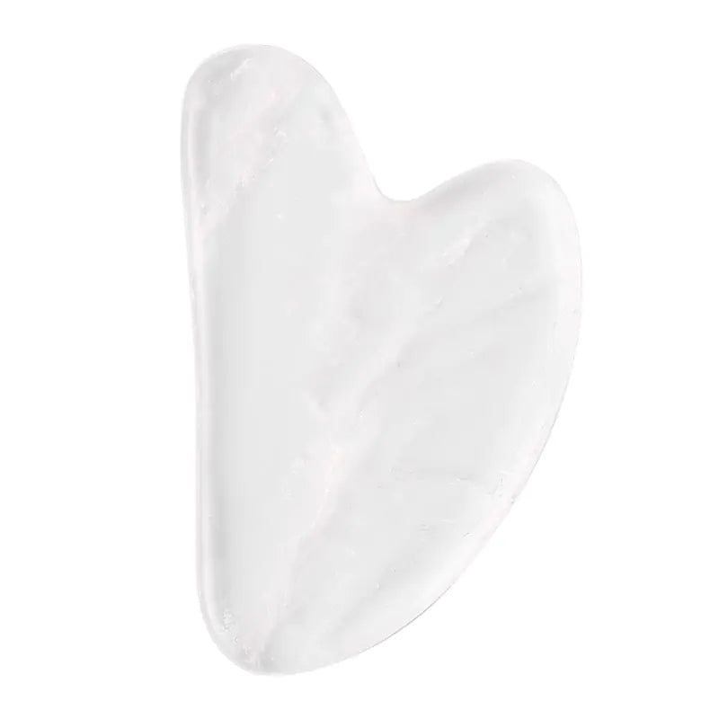 White crystal gua sha tool on a white background