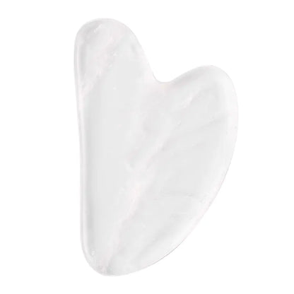 White crystal gua sha tool on a white background