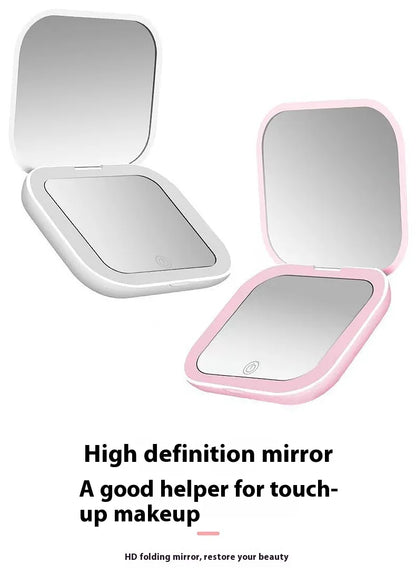 Foldable mirror with pink frame on a white background