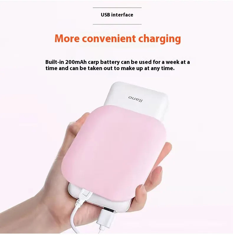 Hand holding a pink and white electronic device with text about USB interface and battery capacity.