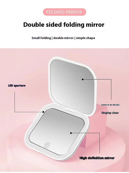 Double-sided folding mirror with features highlighted on a pink background
