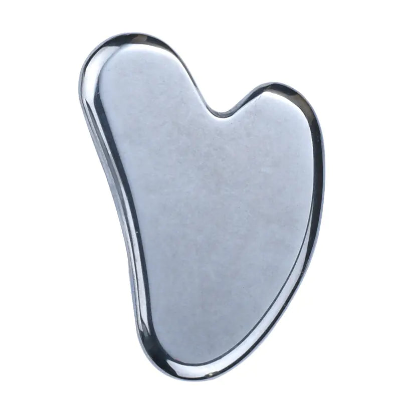 Silver gua sha tool on a white background