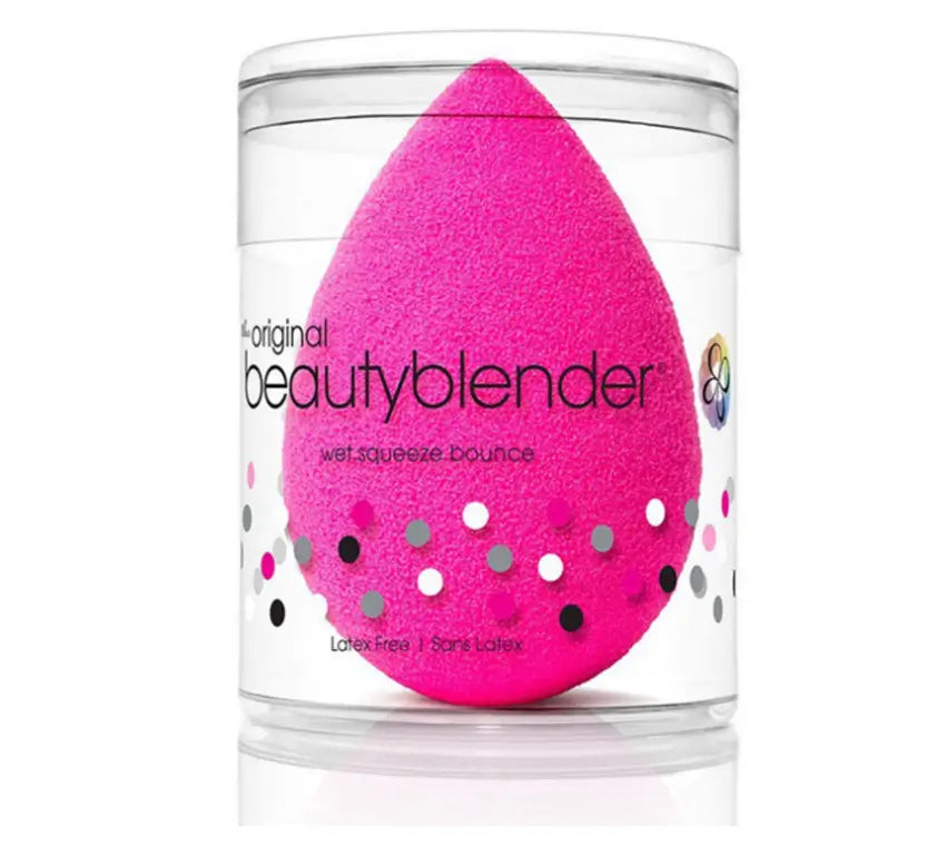Pink beauty blender in a clear container on a white background