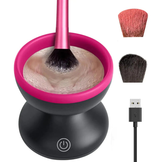 Makeup brush cleaning device with pink brush, black base, and USB cable on a white background.