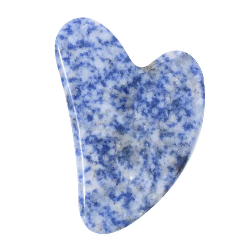 Blue and white speckled gua sha tool on a white background