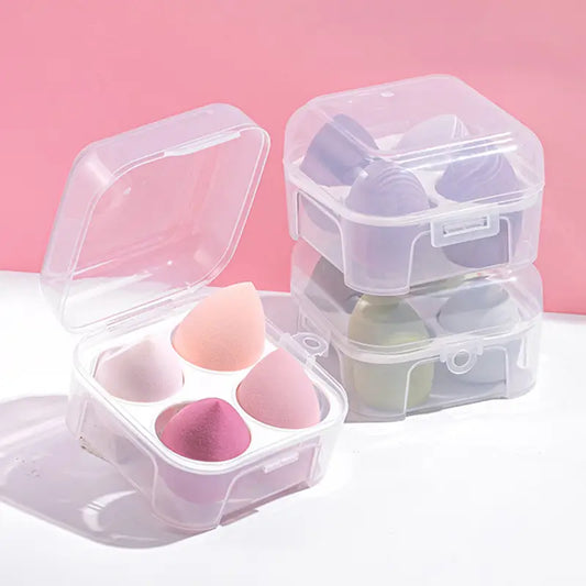 Three clear cosmetic sponge cases with sponges on a pink background