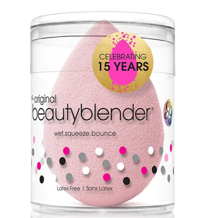 Pink beauty blender in a clear container with confetti design and 'Celebrating 15 Years' label.