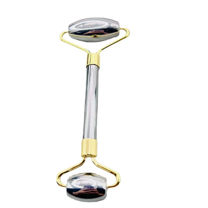Beauty roller with gold and clear design on a white background