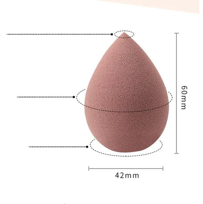 Pink makeup sponge with dimensions labeled on a white background