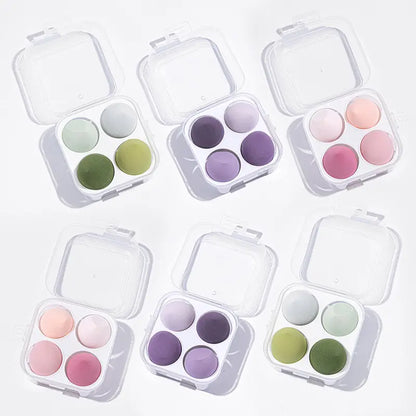Set of six small makeup palettes with pastel colors on a white background