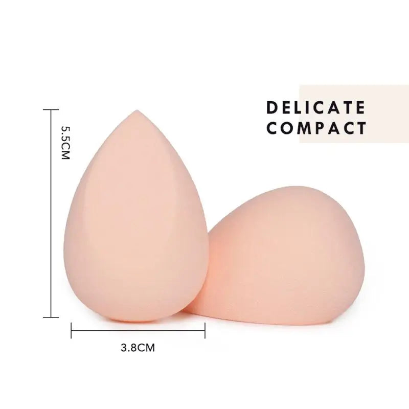 Two beige makeup sponges with measurements on a white background
