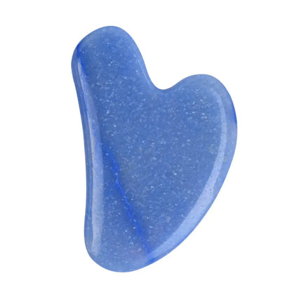 Blue gua sha tool on a white background