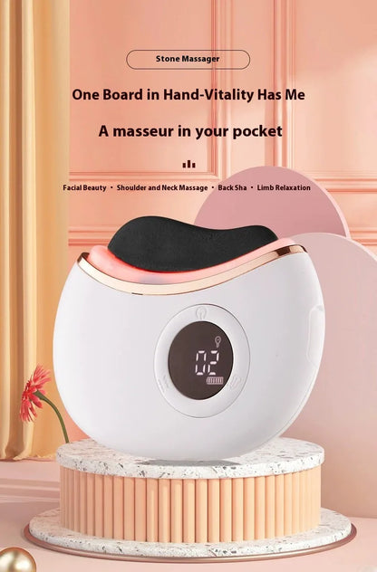 White stone massager with digital display on a pink background