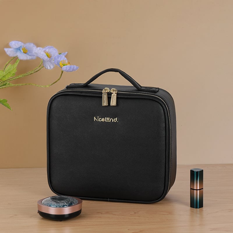 Black makeup bag on a wooden surface with decorative elements.