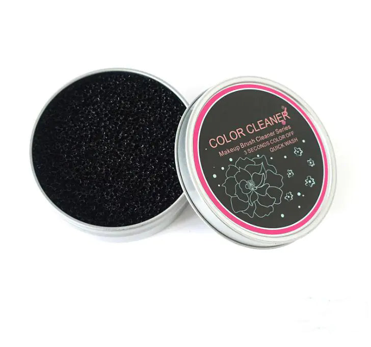 Makeup brush cleaner with black sponge inside a round container on a white background