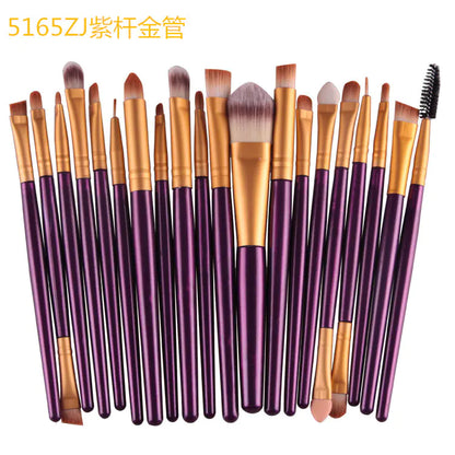 Set of 20 makeup brushes with purple handles and gold ferrules on a white background.