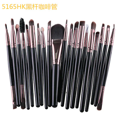 Set of makeup brushes with black handles and rose gold ferrules on a white background.