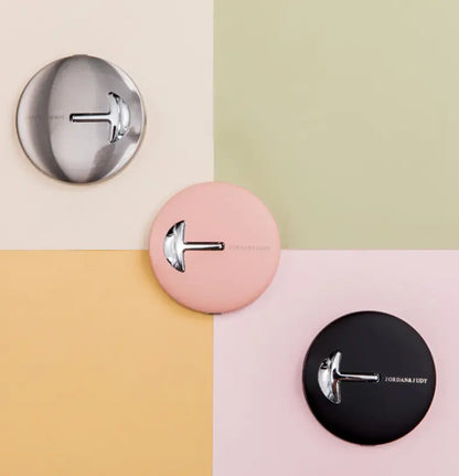 Three LED folding makeup mirror on a colorful geometric background