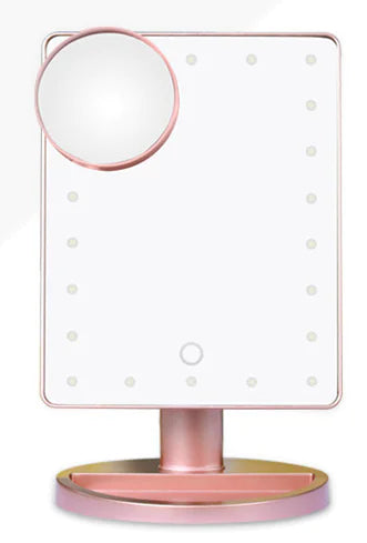 Pink vanity mirror with LED lights on a white background
