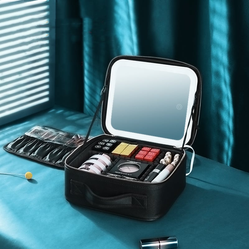 Makeup case with mirror on a blue surface
