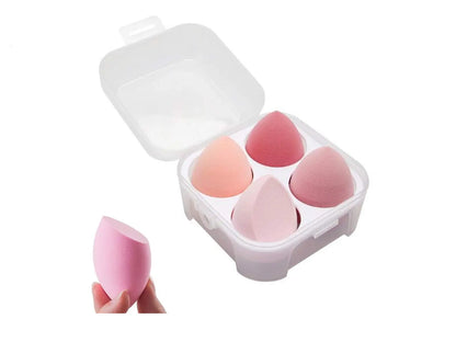 Set of pink makeup sponges in a white case on a white background