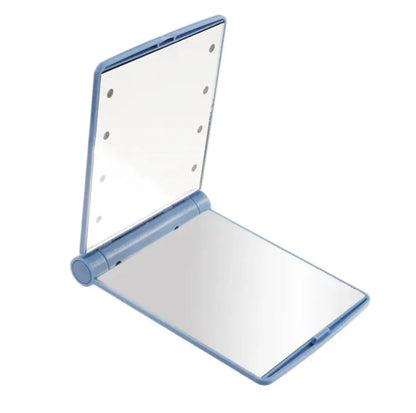 Compact mirror with blue frame on a white background