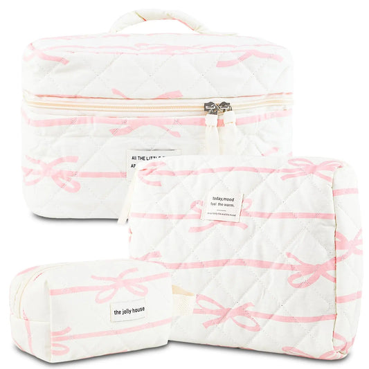 White cosmetic bag with pink bow pattern and 'the jolly house' branding on a white background