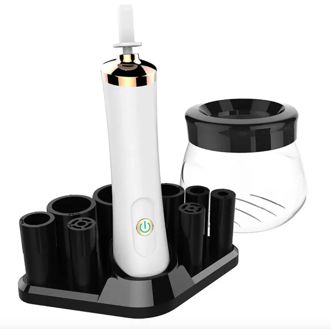 White electric makeup brush cleaner with black stand and holder on a white background