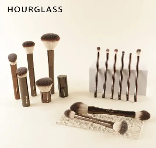 Hourglass makeup brushes on a white background