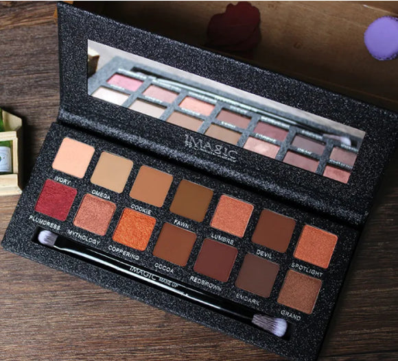 Makeup palette with various shades on a wooden surface