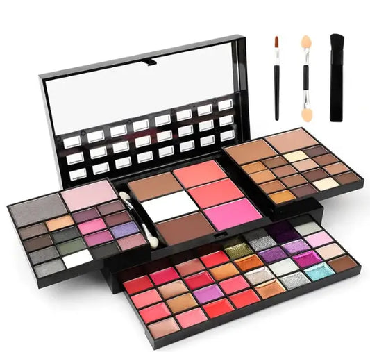 Makeup palette set with various colors and brushes on a white background