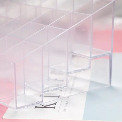 Clear acrylic display stand with a pink and white gradient background