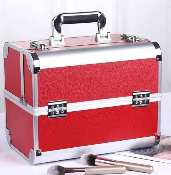 Red makeup case with silver accents on a white background