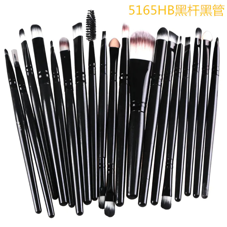 Set of black makeup brushes on a white background