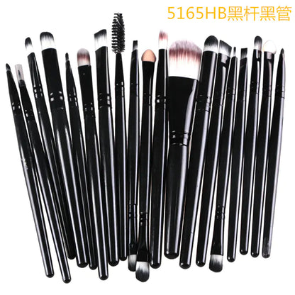 Set of black makeup brushes on a white background