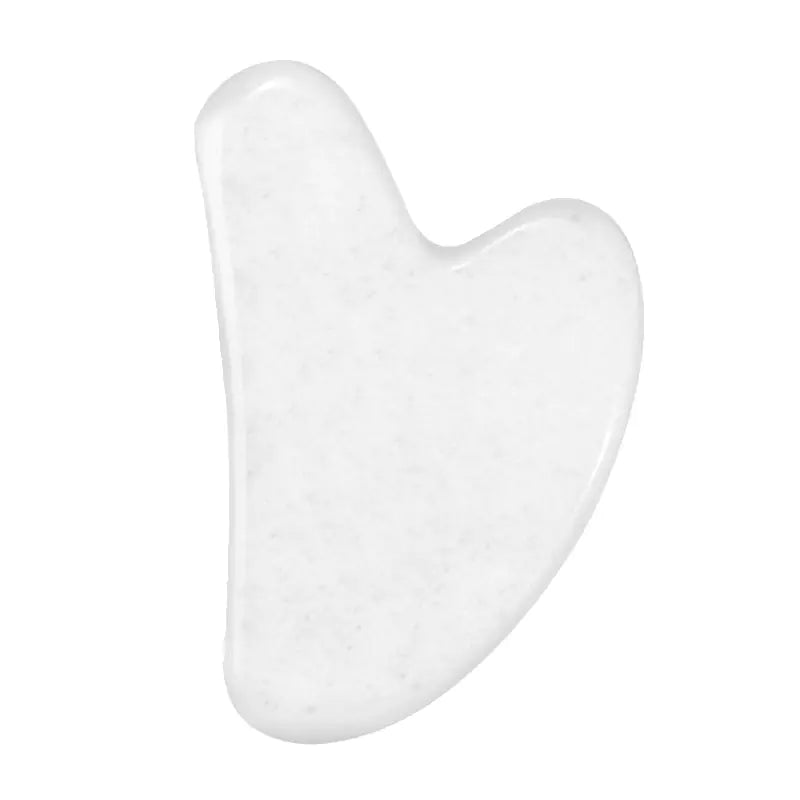 White jade gua sha tool on a white background