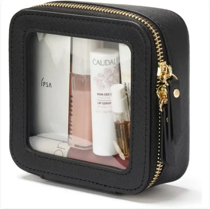 Black portable mini organizer bag with cosmetic products inside on a white background