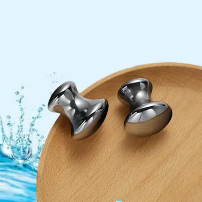 Silver mushroom heads on a wooden surface with water splash graphics