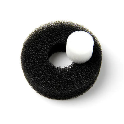 Black foam ring with a white ball on a white background