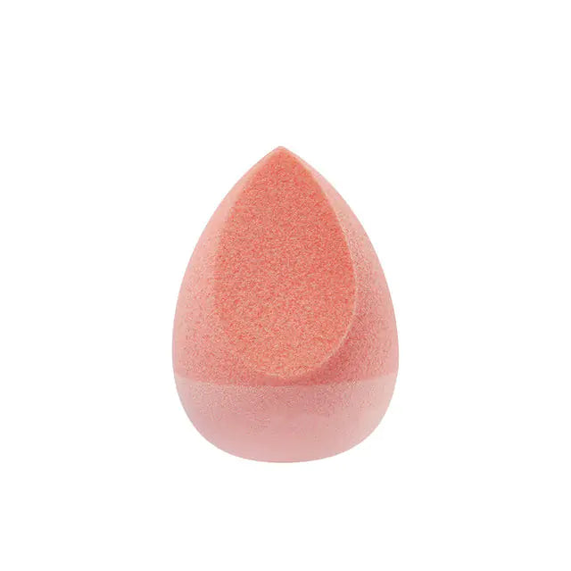 Orange makeup sponge on a white background