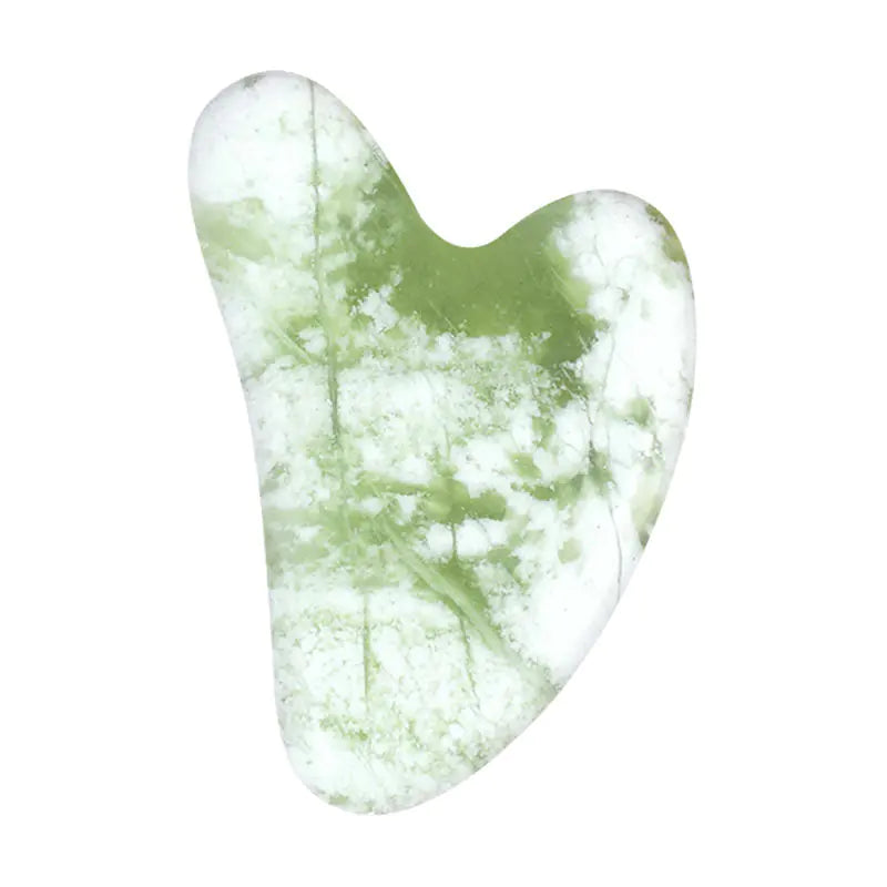 Green and white marbled gua sha tool on a white background