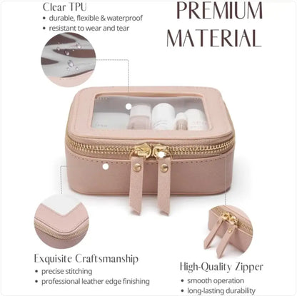 Pink travel case with clear top, gold zipper, and cosmetic items inside on a white background.