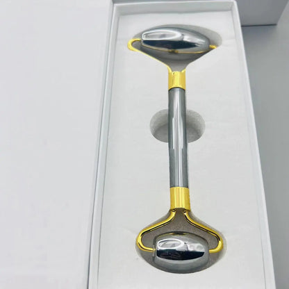 Metallic tool with gold accents on a white background