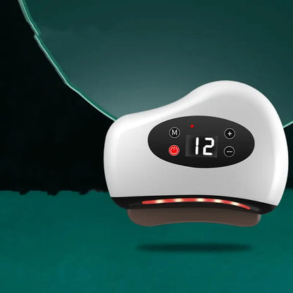 White gua sha electronic device with digital display on a teal background