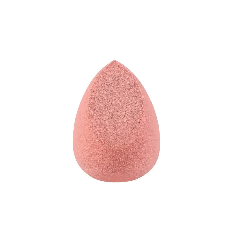 Pink makeup sponge on a white background