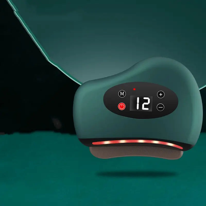 Green Gua Sha device with digital control panel on a dark background